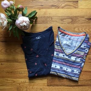 Two fun patterned V Neck t shirts